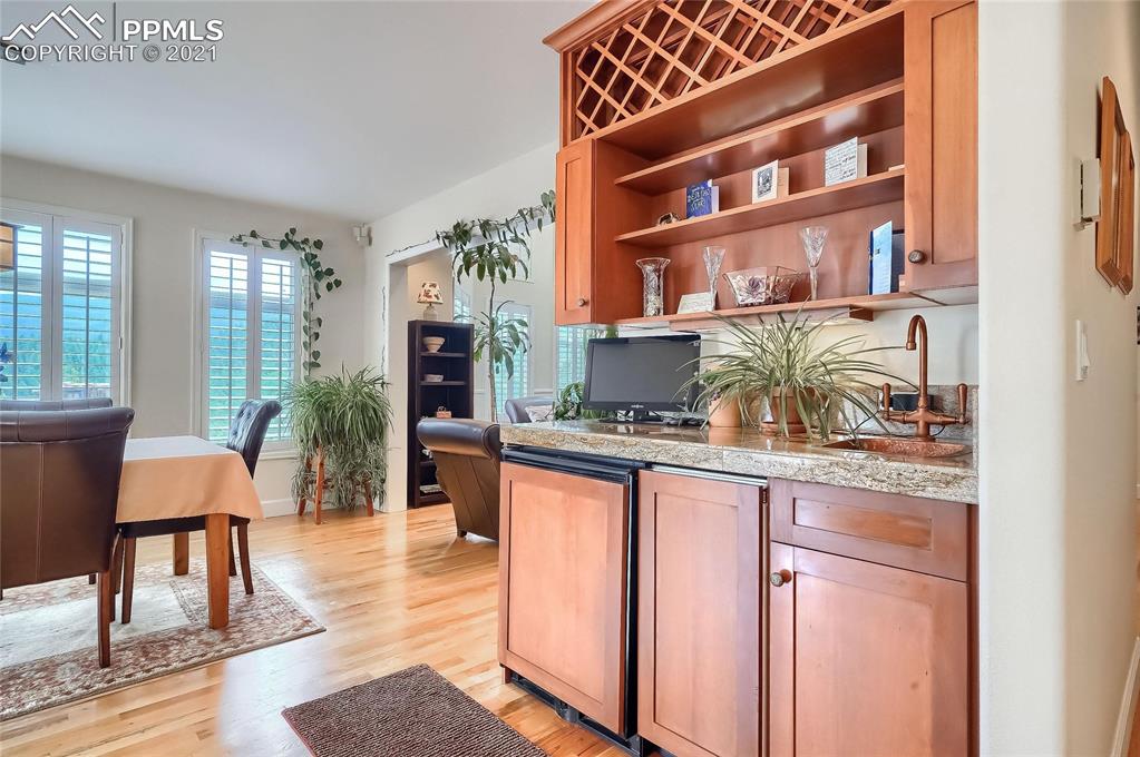 623 West Meadow Road Evergreen, CO 80439 - Photo 27 of 49 a kitchen with stainless steel appliances granite countertop a table and chairs in it