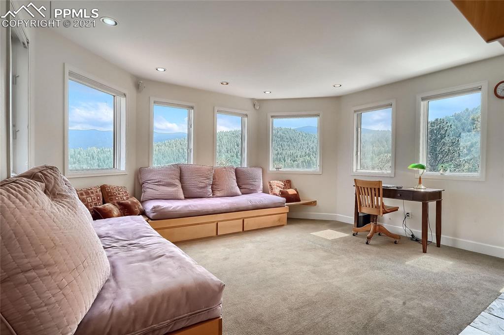 623 West Meadow Road Evergreen, CO 80439 - Photo 28 of 49 a living room with furniture and a large window