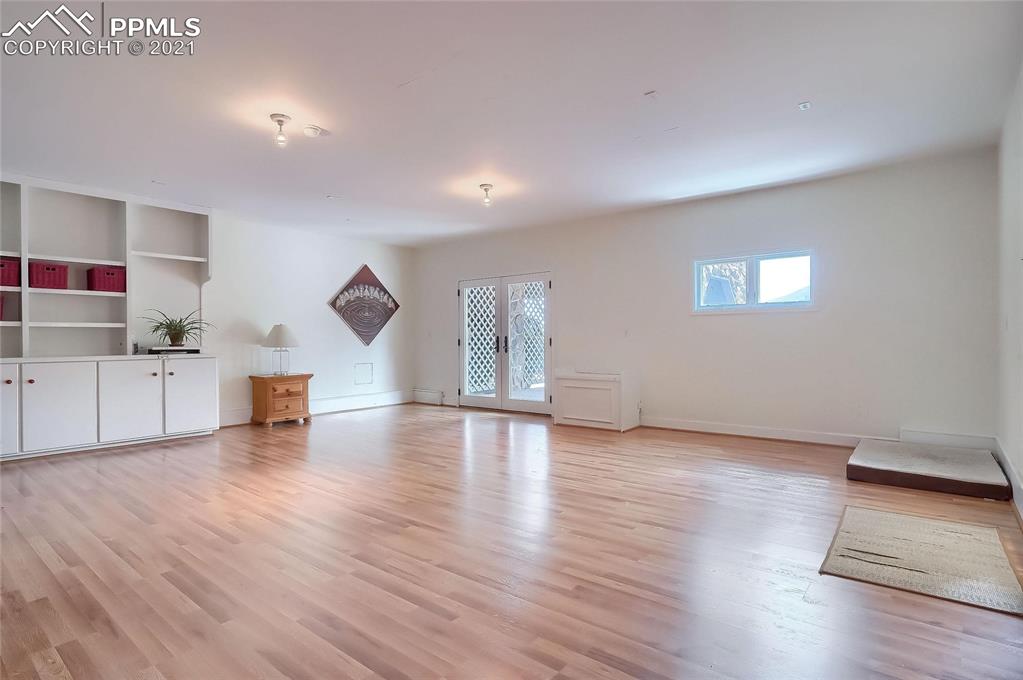 623 West Meadow Road Evergreen, CO 80439 - Photo 31 of 49 a view of empty room with wooden floor