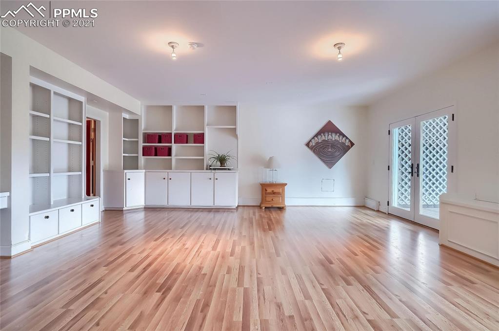 623 West Meadow Road Evergreen, CO 80439 - Photo 32 of 49 a view of empty room with wooden floor and cabinet