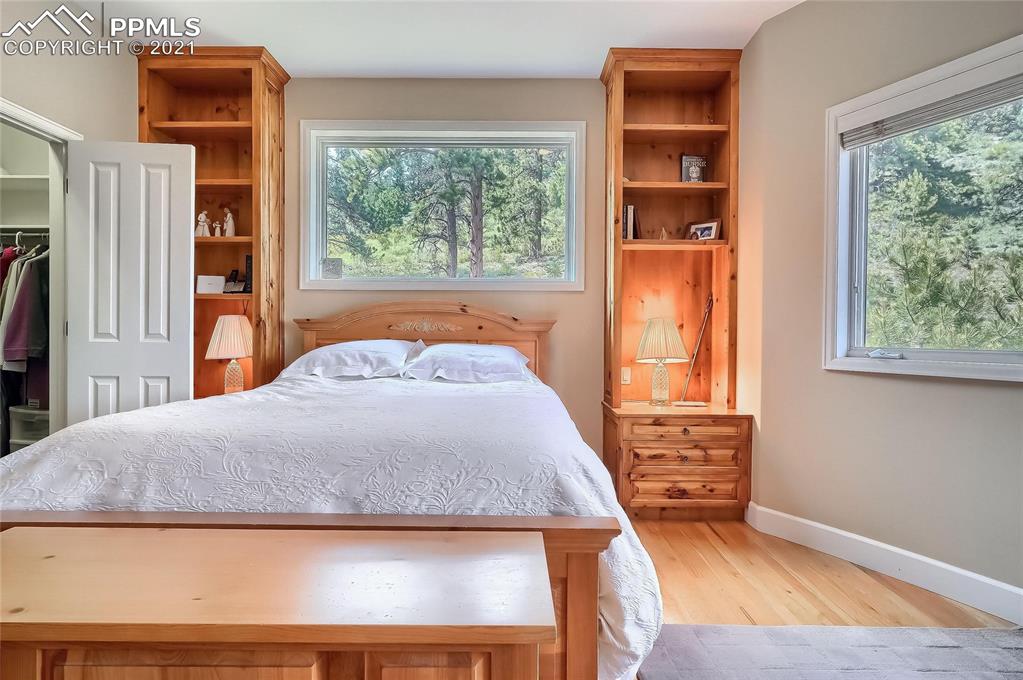 623 West Meadow Road Evergreen, CO 80439 - Photo 34 of 49 a bedroom with a bed and a window