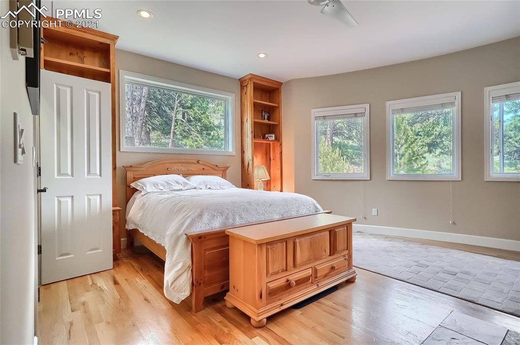 623 West Meadow Road Evergreen, CO 80439 - Photo 35 of 49 a bed sitting in a spacious bedroom next to a window