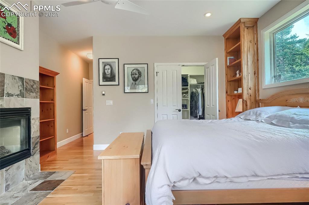 623 West Meadow Road Evergreen, CO 80439 - Photo 36 of 49 a bedroom with a bed and a television