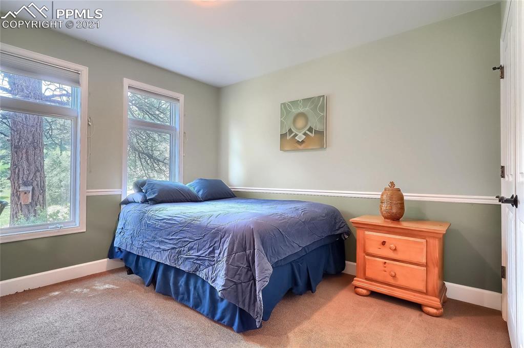 623 West Meadow Road Evergreen, CO 80439 - Photo 41 of 49 a bedroom with a bed and a window