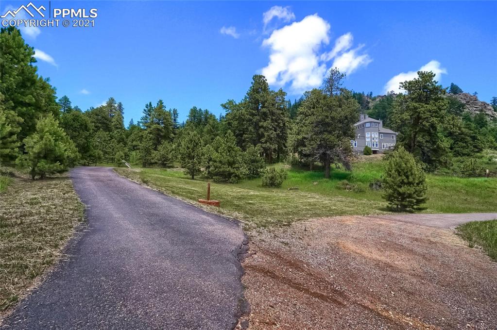 623 West Meadow Road Evergreen, CO 80439 - Photo 49 of 49 a view of a yard with a house in the background