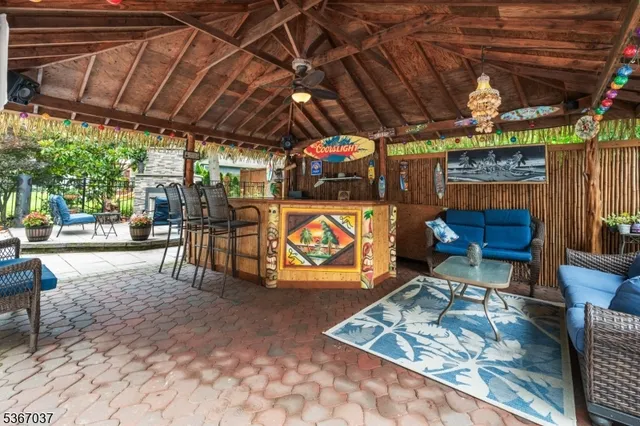 a front view of a house with plants