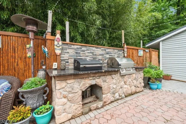 a view of a patio with furniture and a potted plant
