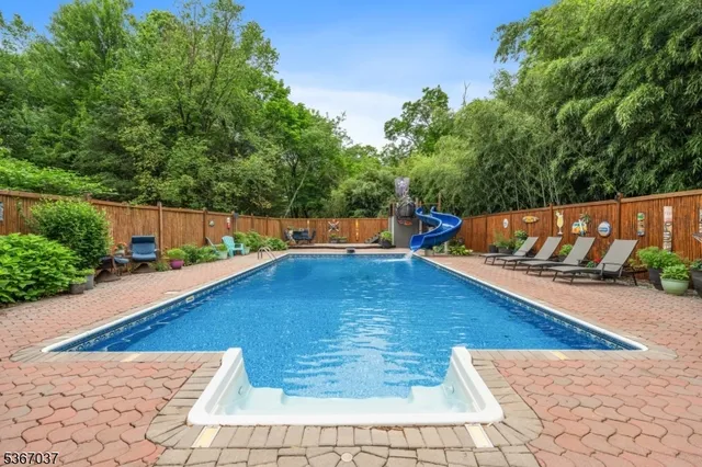 a front view of a house with sitting area