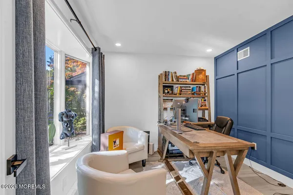 a view of a workspace with furniture