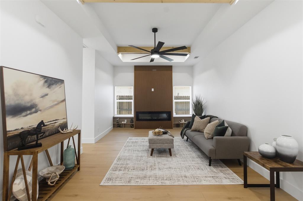435 Waterboard Road Trinidad, TX 75163 - Photo 7 of 39 Spacious living area featuring light wood-finish flooring and a vaulted ceiling with exposed wood beams