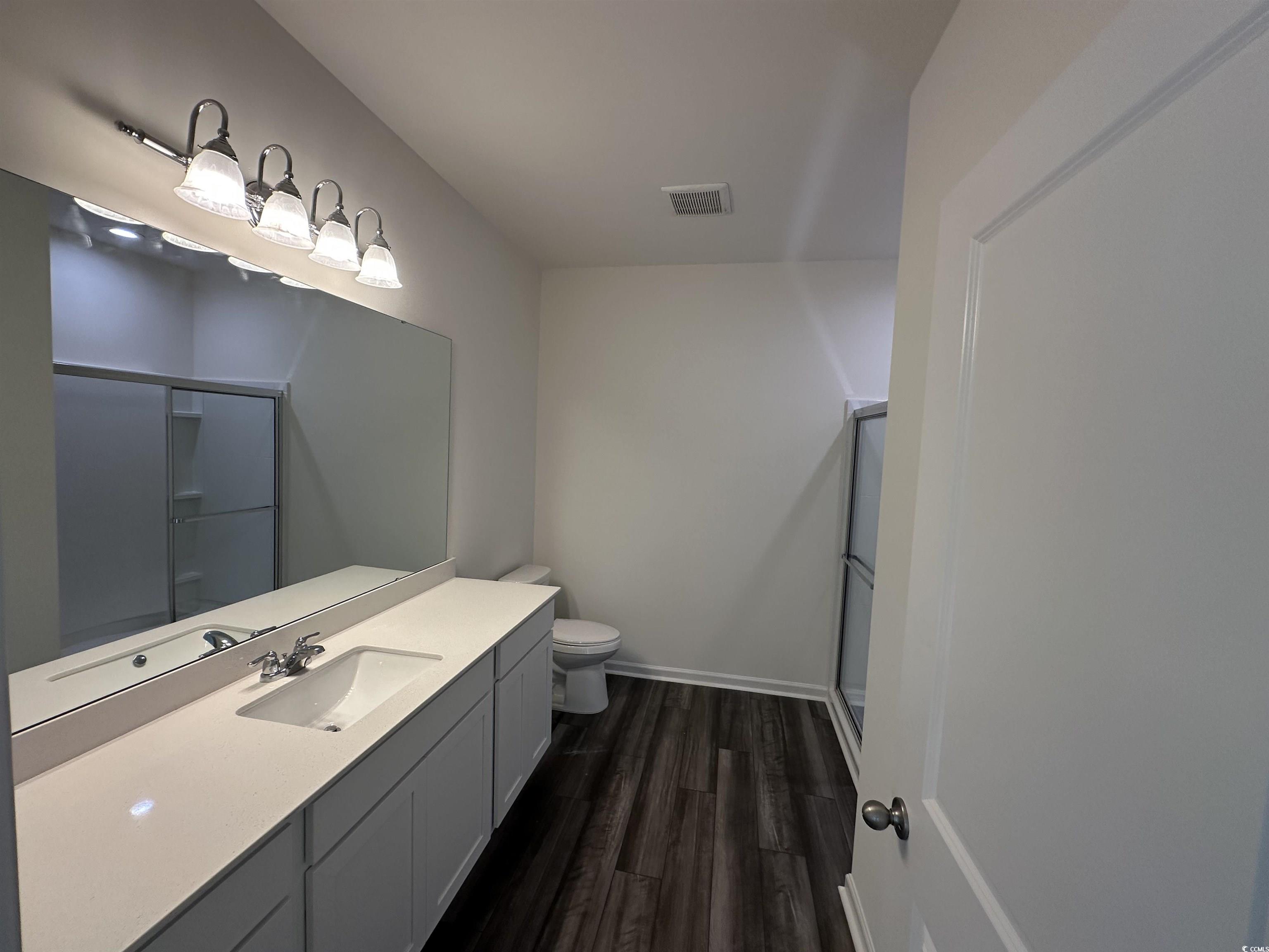 648 Castillo Drive Loris, SC 29569 - Photo 13 of 15 Full bathroom featuring vanity, toilet, visible ve