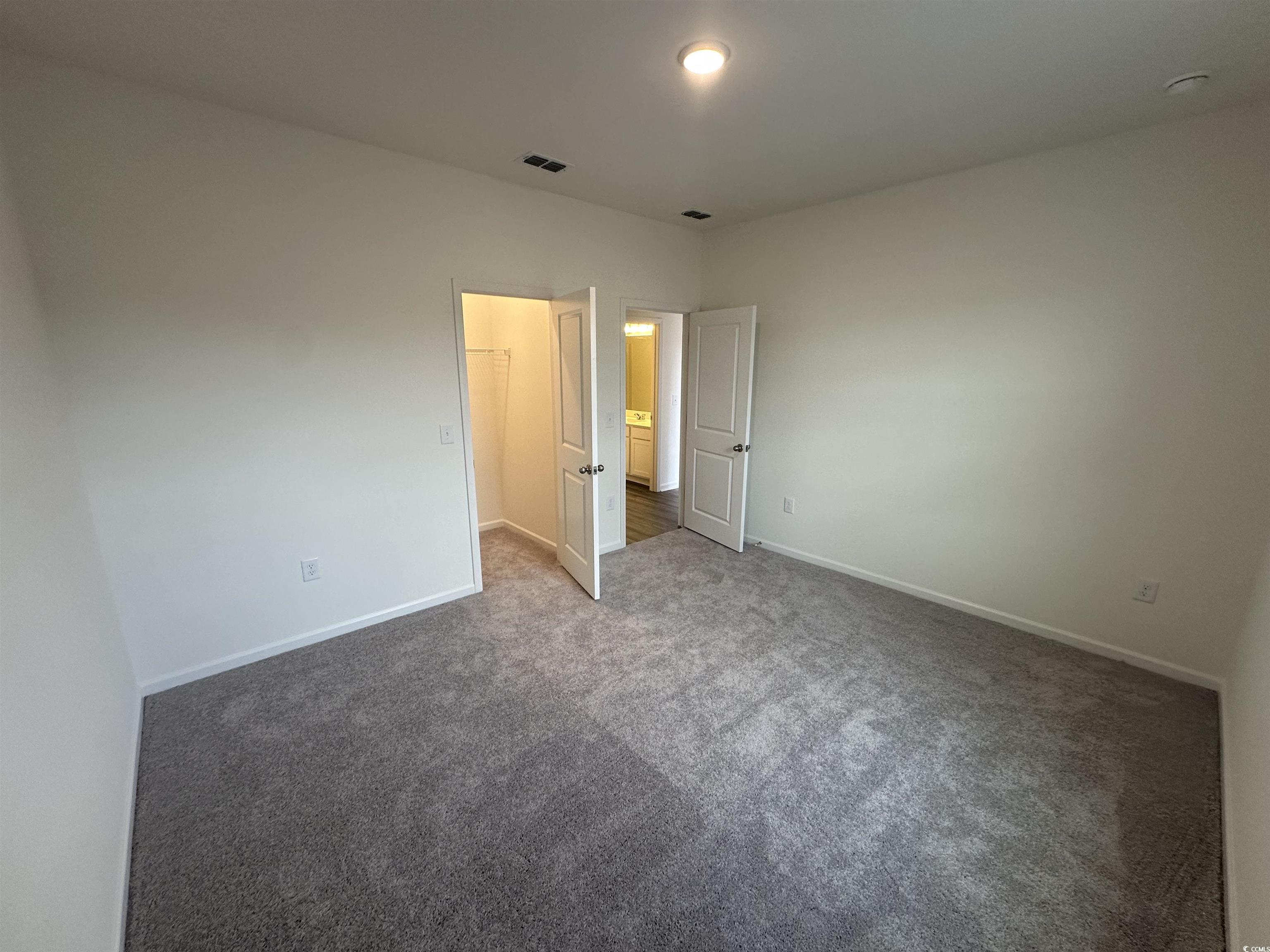 648 Castillo Drive Loris, SC 29569 - Photo 5 of 15 Unfurnished bedroom with baseboards, carpet floori