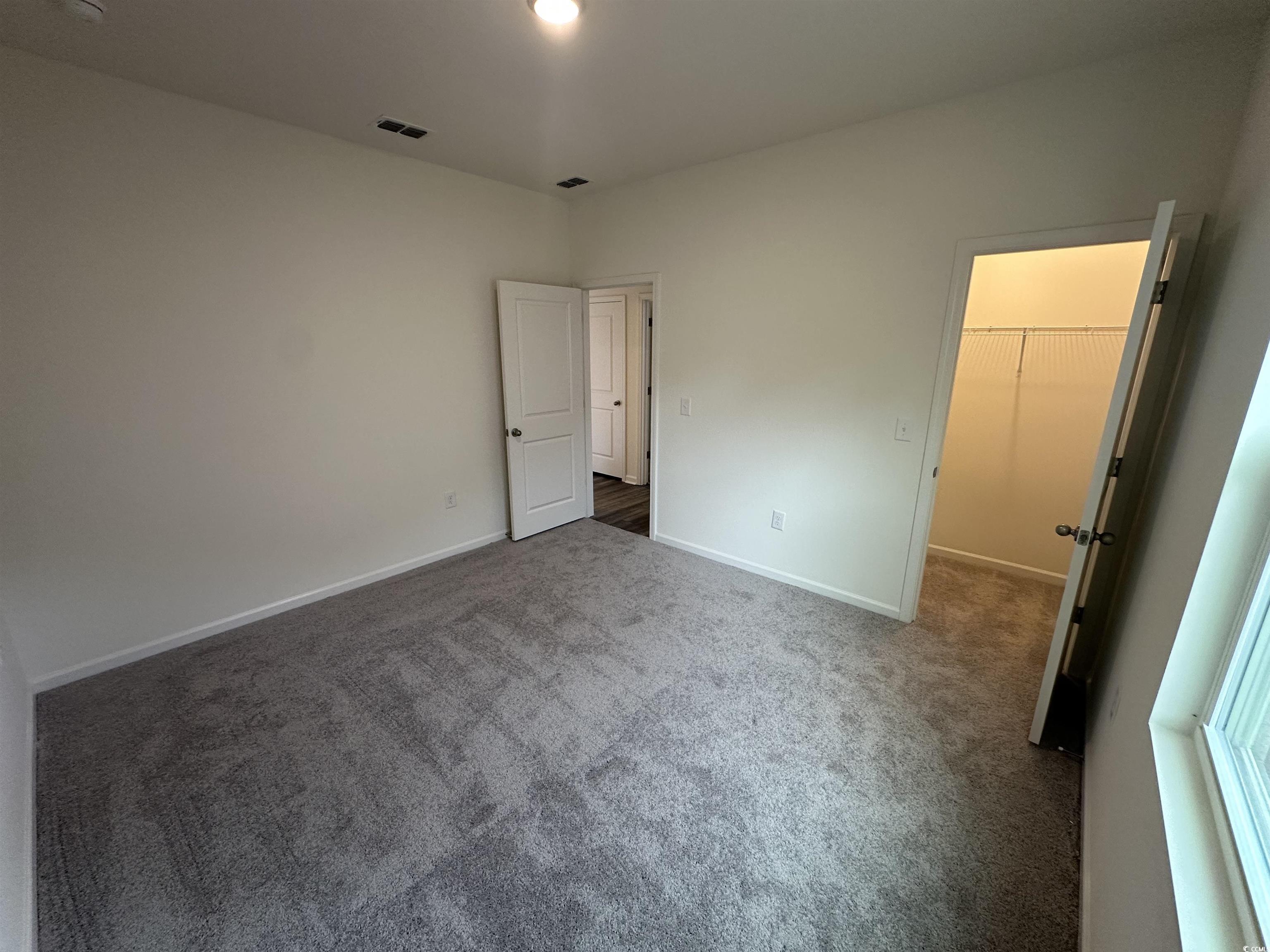 648 Castillo Drive Loris, SC 29569 - Photo 6 of 15 Unfurnished bedroom featuring baseboards, visible