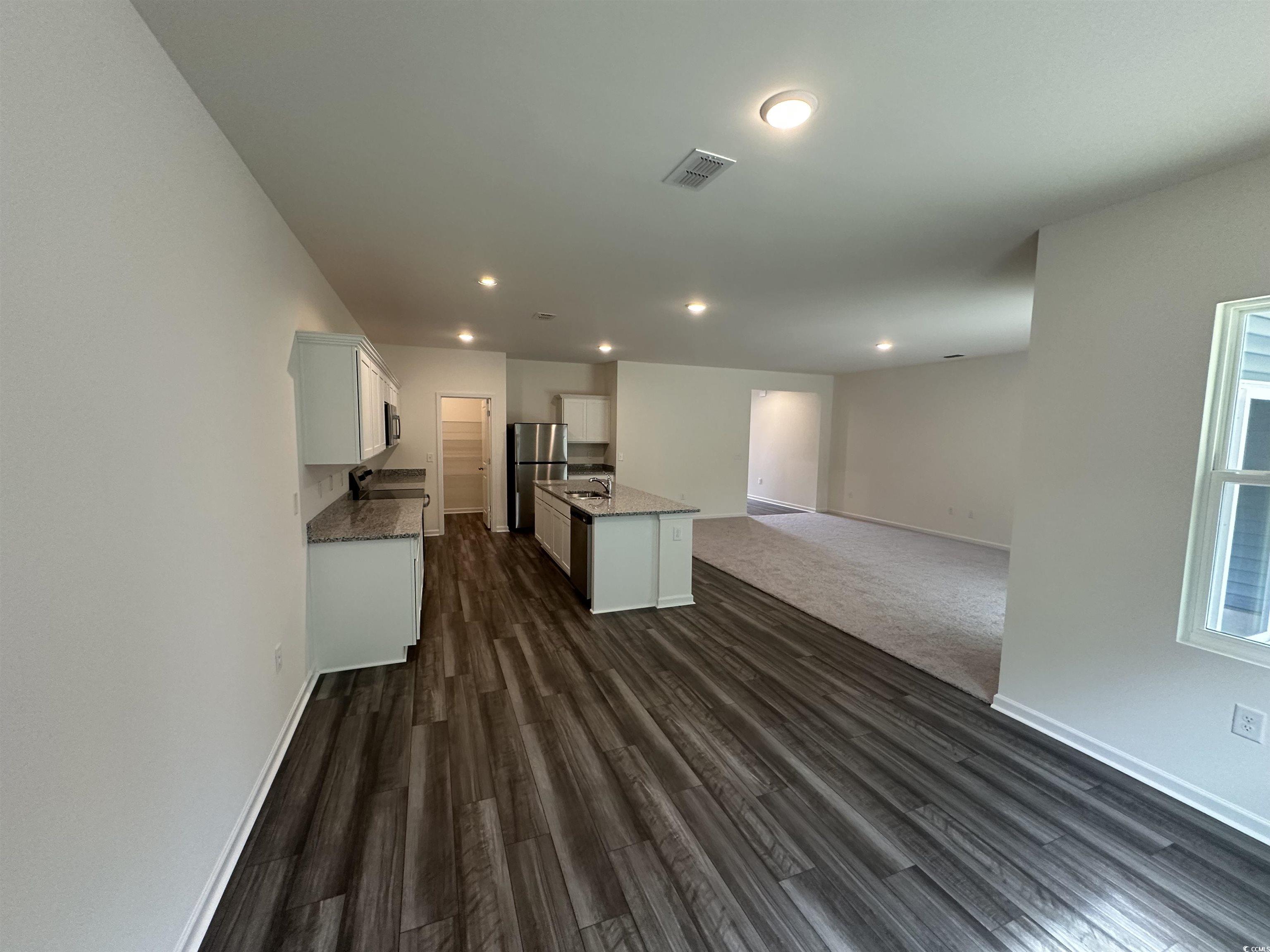 648 Castillo Drive Loris, SC 29569 - Photo 15 of 15 Kitchen with open floor plan, white cabinetry, an