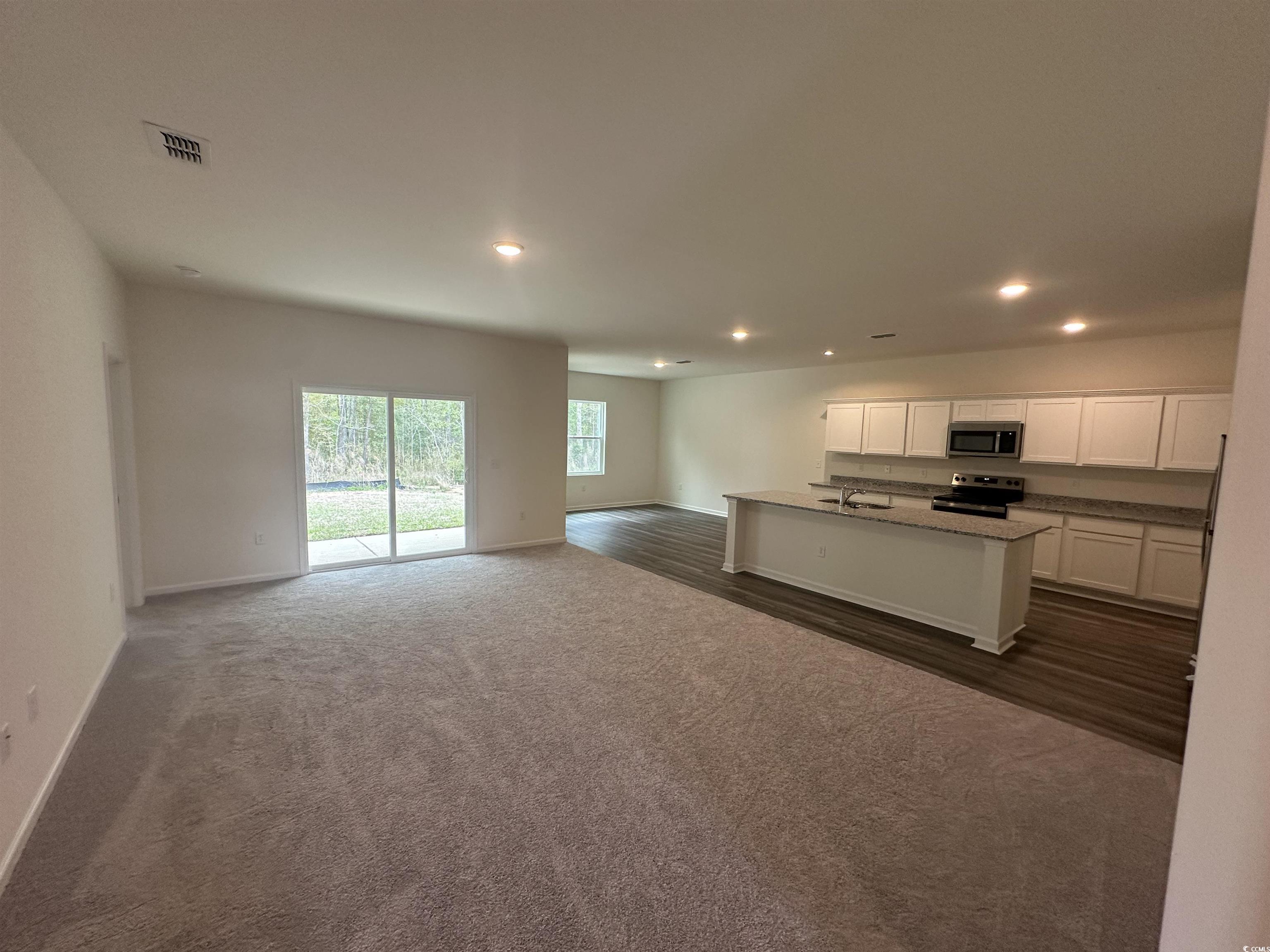 648 Castillo Drive Loris, SC 29569 - Photo 9 of 15 Kitchen with visible vents, baseboards, stainless