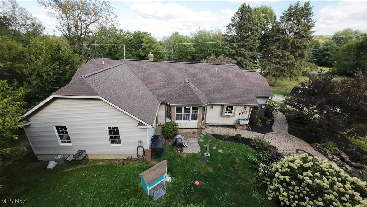 8124 Hartman Road Wadsworth, OH 44281 - Photo 23 of 50 Rear view of house with a lawn