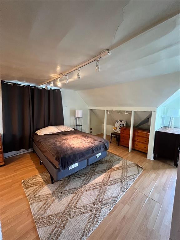 208 Morton Avenue Butler, PA 16001 - Photo 25 of 28 a spacious bedroom with a bed and wooden floor