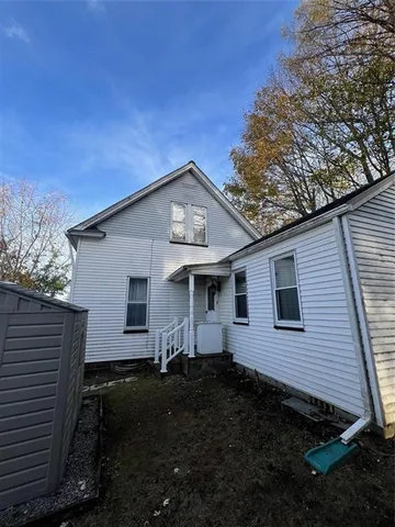 a front view of a house with yard