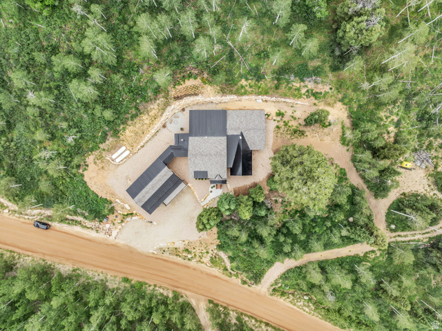 1766 West Tollgate Cyn Road Coalville, UT 84017 - Photo 57 of 59 Contemporary residence with a multi-level roofline, surrounded by dense natural foliage