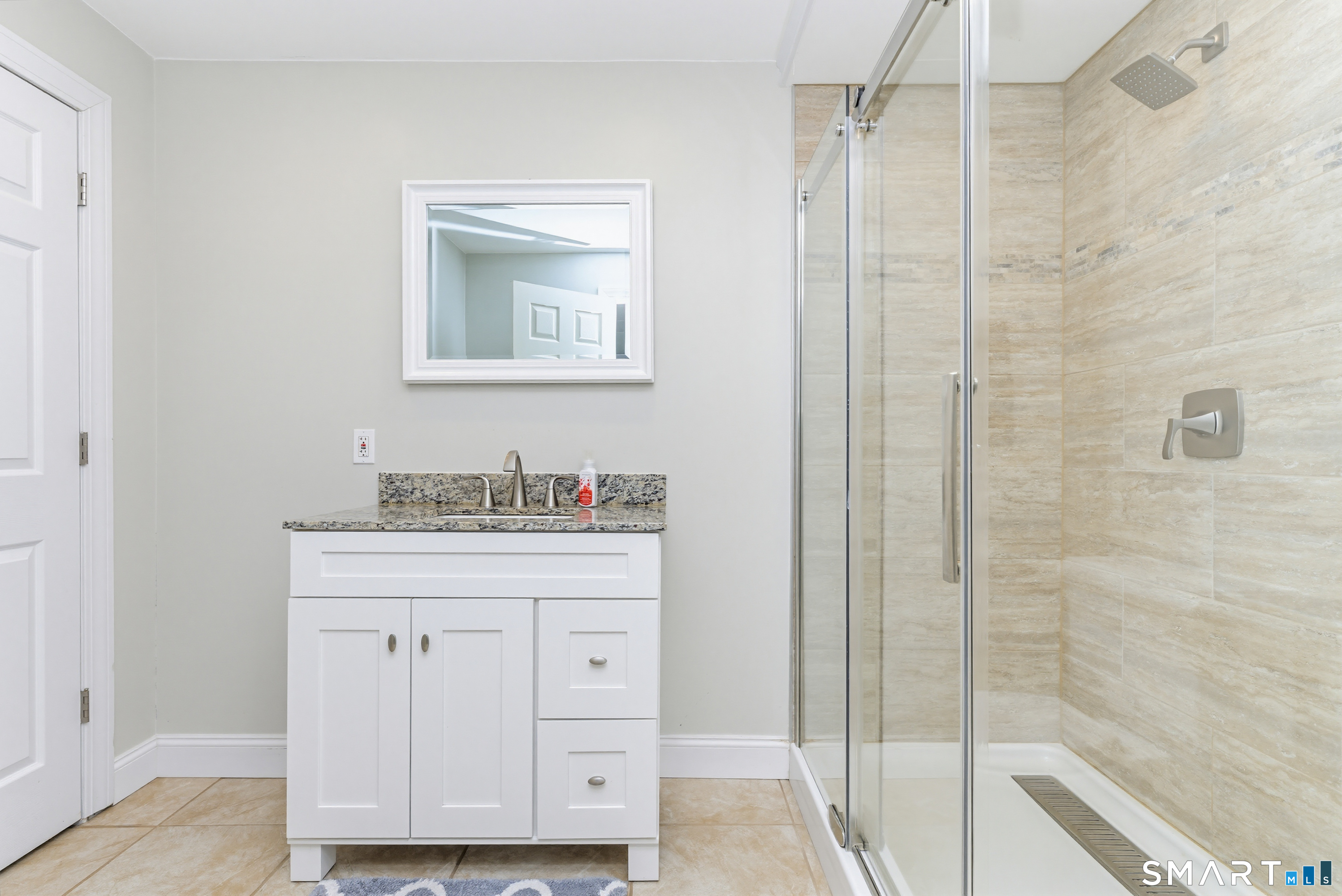 30 Block Farm Road Monroe, CT 06468 - Photo 33 of 40 a bathroom with a granite countertop sink a mirror and a shower
