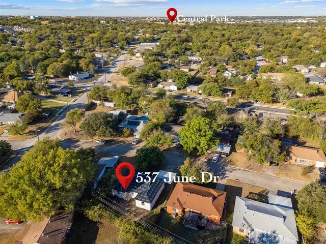 an aerial view of a red and white house