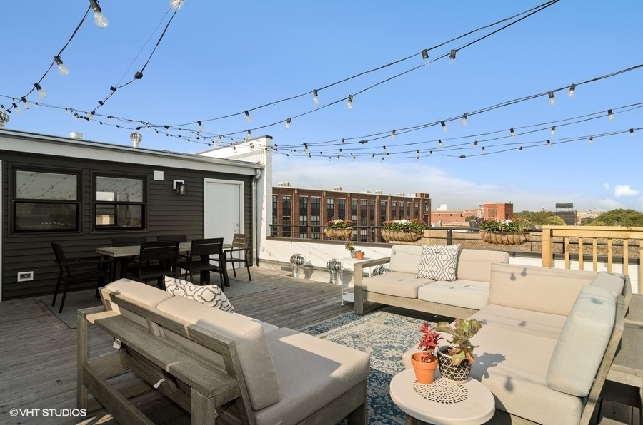 Undisclosed Address Chicago, IL 60647 - Photo 22 of 26 a living room with furniture and a fireplace