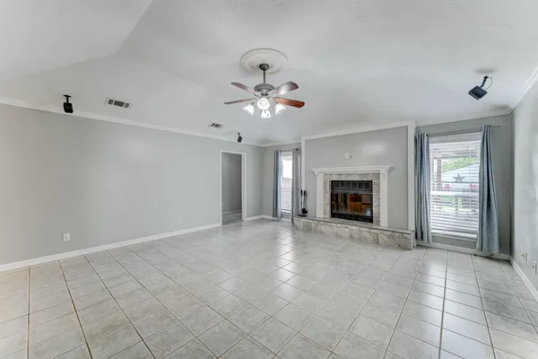 a large kitchen with stainless steel appliances kitchen island granite countertop a sink and cabinets