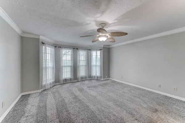 a view of an empty room with a fireplace