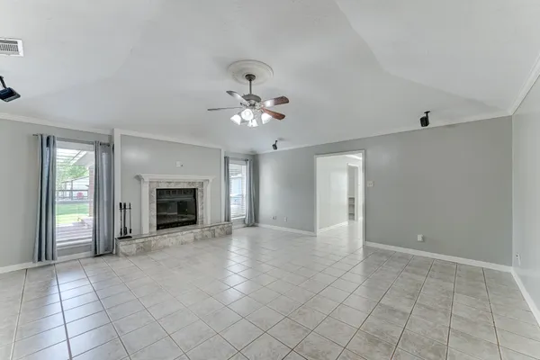 a kitchen with granite countertop white cabinets and stainless steel appliances