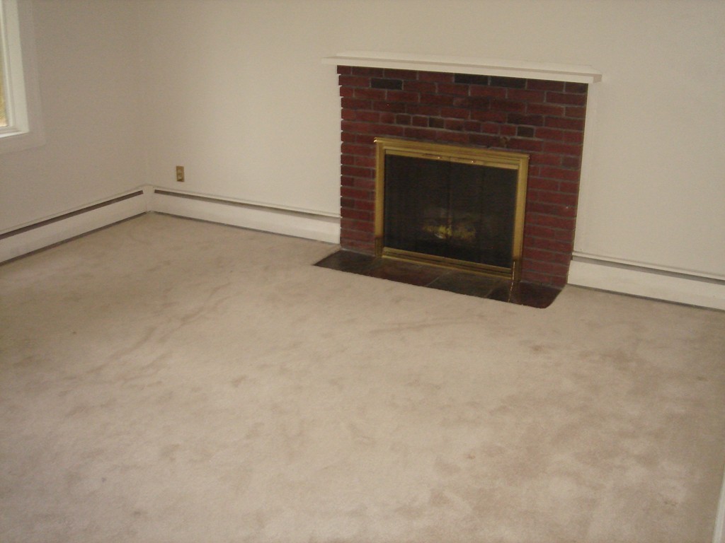 23 Lyndon Road Sharon, MA 02067 - Photo 13 of 17 a living room with a fireplace