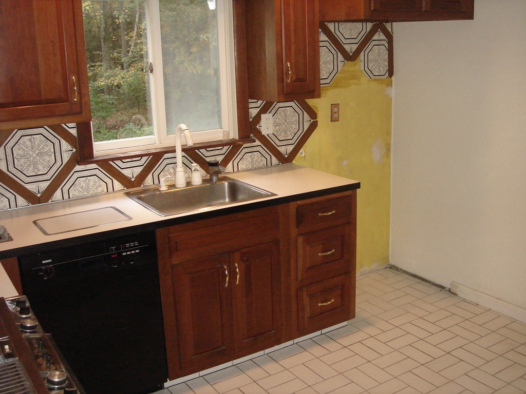 23 Lyndon Road Sharon, MA 02067 - Photo 7 of 17 a bathroom with a sink and a mirror