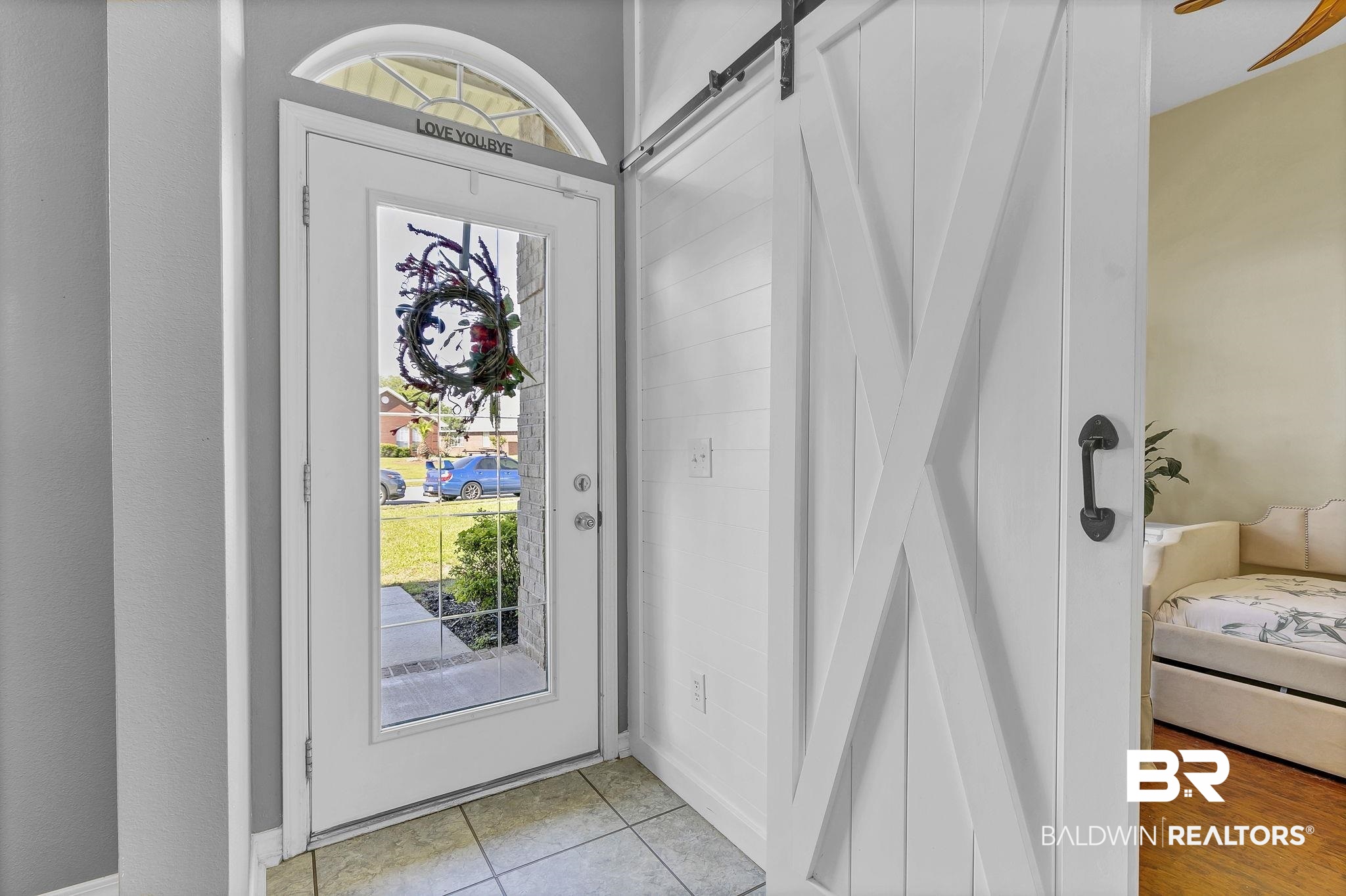 16358 Tempest Drive Foley, AL 36535 - Photo 6 of 46 Entrance foyer featuring a barn door and light tile patterned flooring
