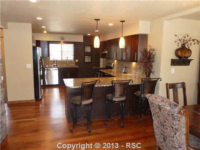 9080 Hardin Road Colorado Springs, CO 80908 - Photo 6 of 25 New appliances, Brazilian cherry wood floors. New cabinets.