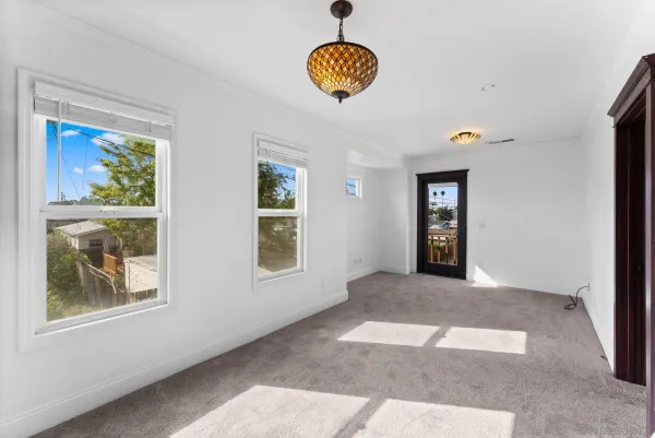 a view of an empty room with a window