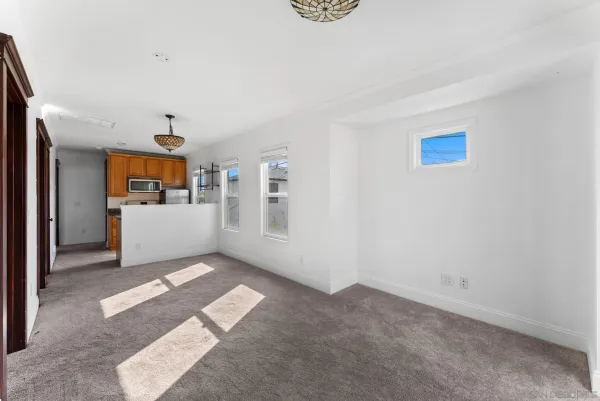 a view of a livingroom with a kitchen