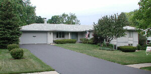 1226 Roxbury Road Rockford, IL 61107 - Photo 1 of 1 a front view of a house with a garden
