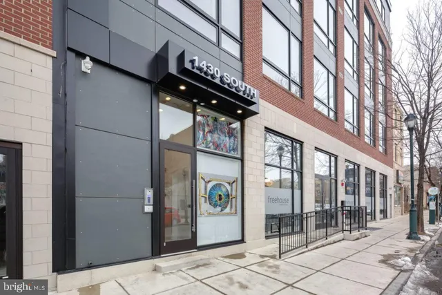 a view of a building with a door and windows