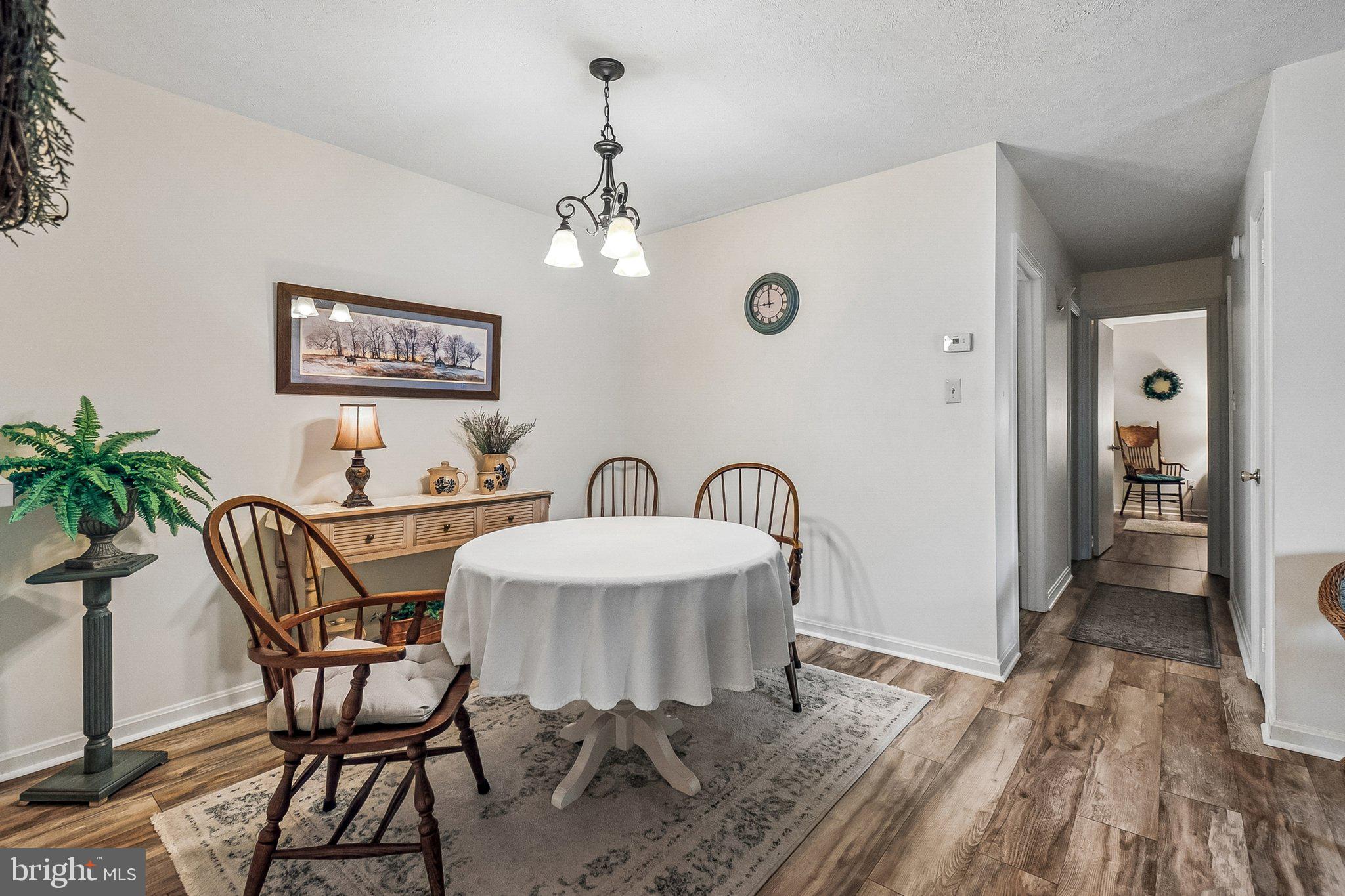 10090 Oakton Terrace Road Oakton, VA 22124 - Photo 14 of 25 a view of a dining room with furniture