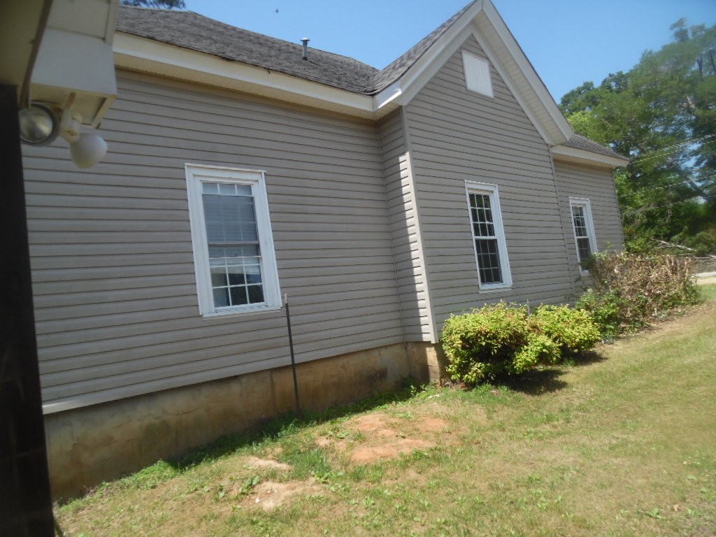 19 Haynes Street Due West, SC 29639 - Photo 4 of 8 A well-maintained side exterior boasts durable siding and neatly trimmed shrubbery.