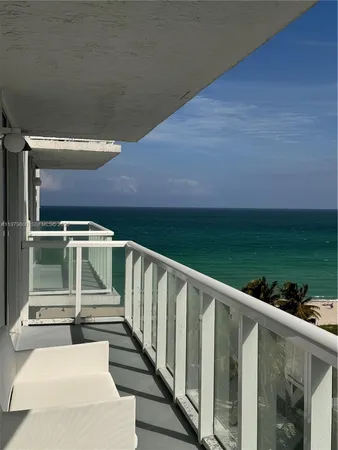 a view of balcony with wooden floor