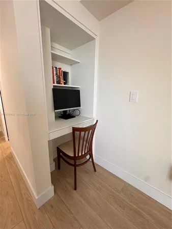 a workspace with furniture and wooden floor