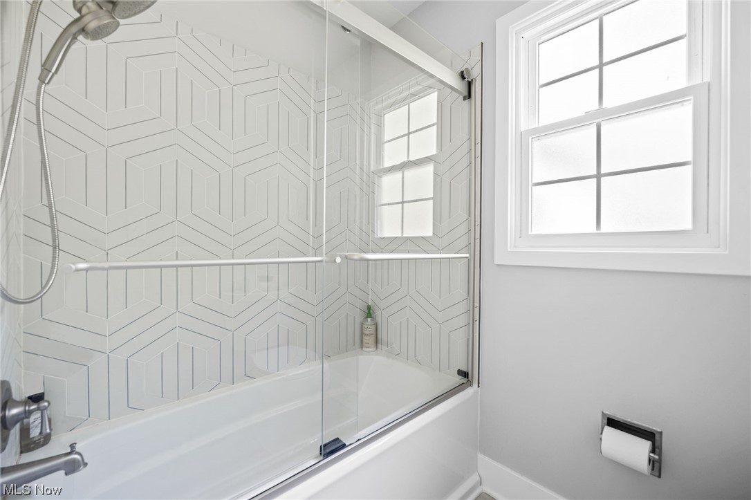 38484 Otten Road North Ridgeville, OH 44039 - Photo 18 of 32 Bathroom featuring bath / shower combo with glass door