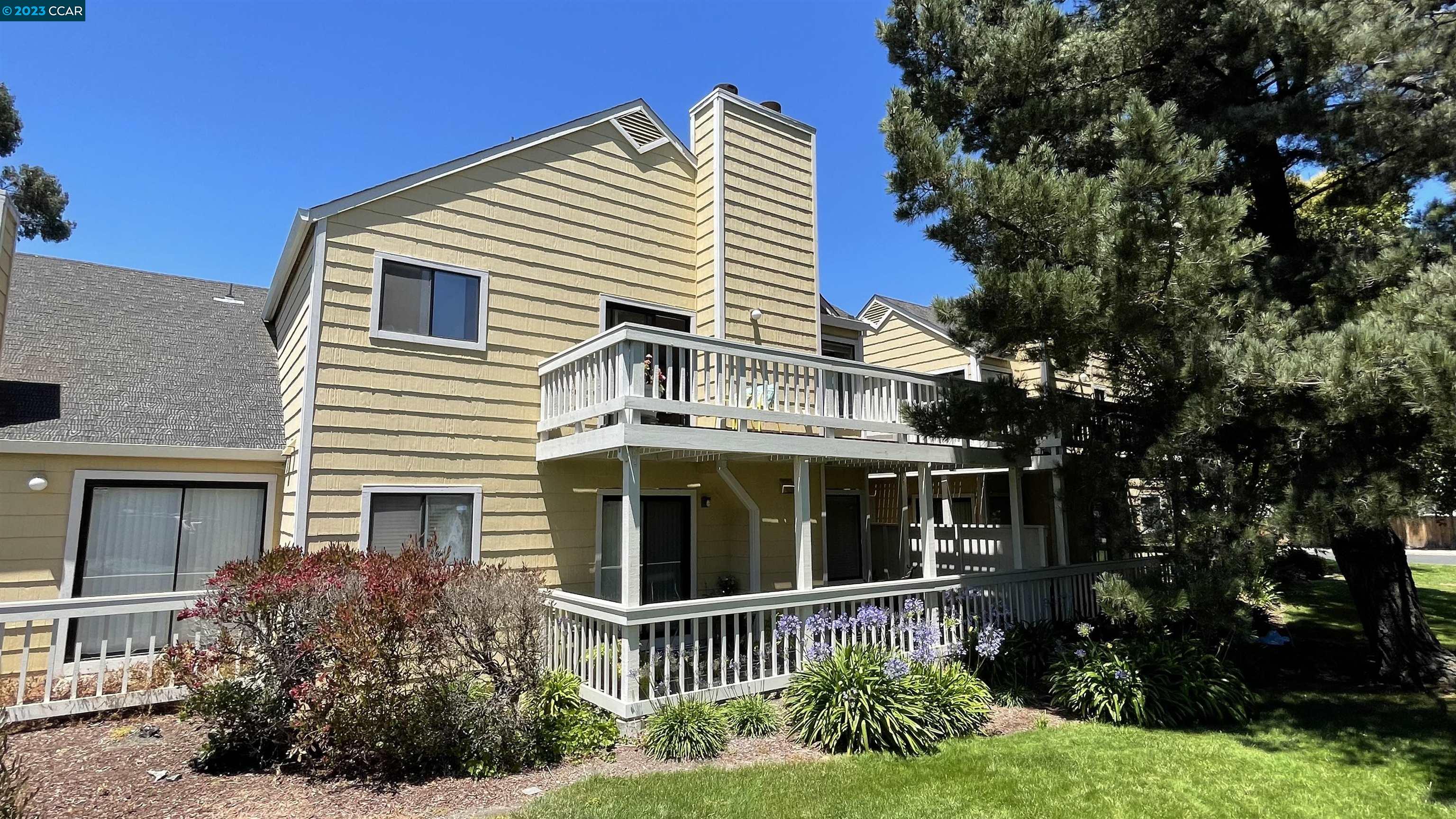 a view of house with a yard