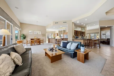 a living room with furniture and a table