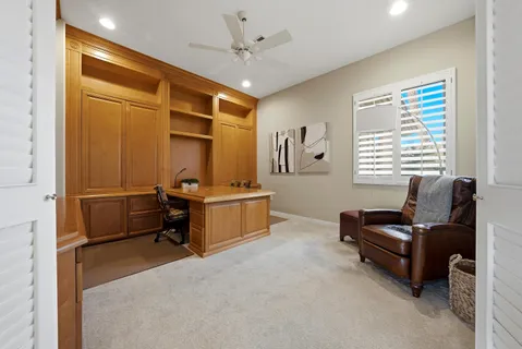 a bedroom with furniture and a window