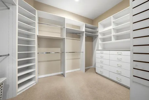 a view of an empty walk in closet