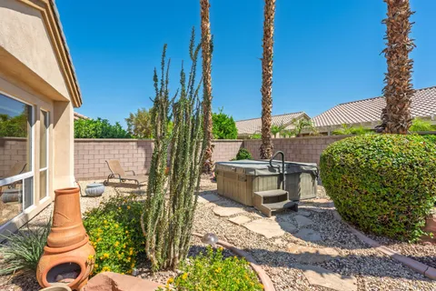 a view of a backyard with sitting area