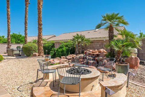 a view of swimming pool with outdoor seating