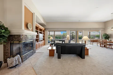 a living room with furniture and fireplace