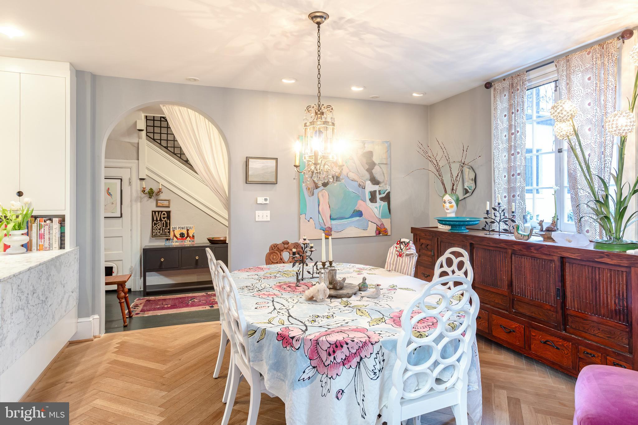 2633 15th Street Northwest, Unit 3 Washington, DC 20009 - Photo 12 of 53 a dining room with wooden floor and large windows